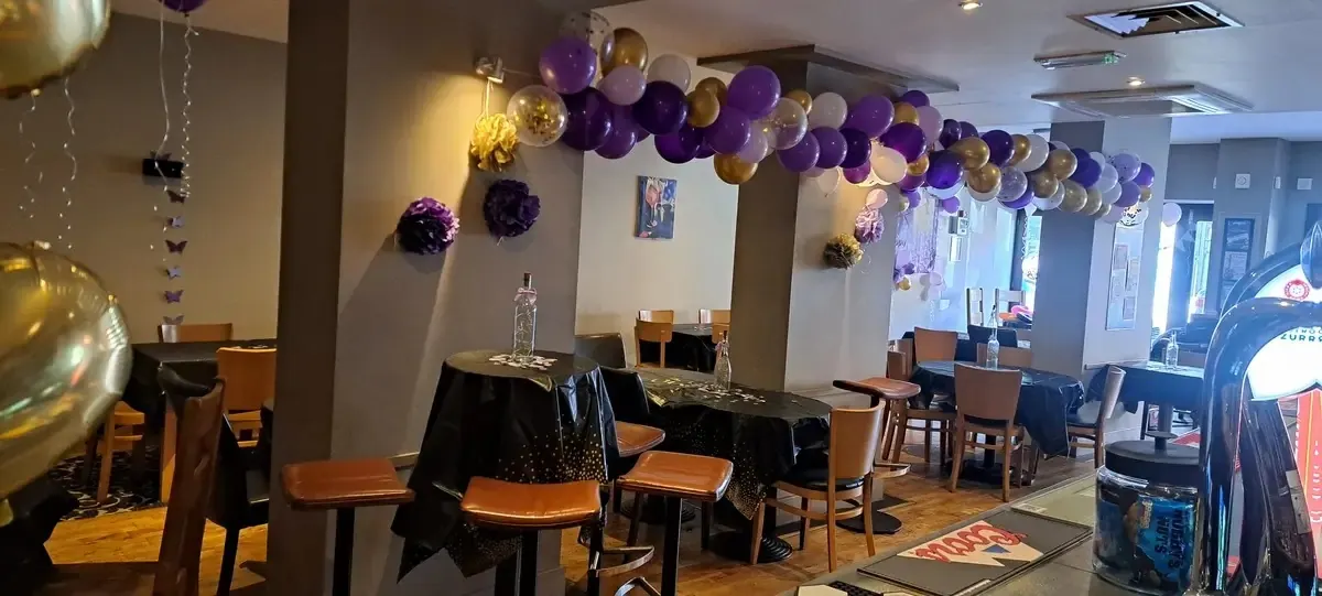 Enigma's private hire room decorated with balloons for a celebration