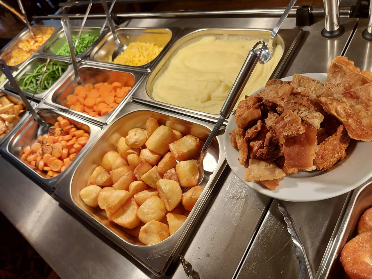 Roast potatoes, vegetables, mash and crackling on the carvery
