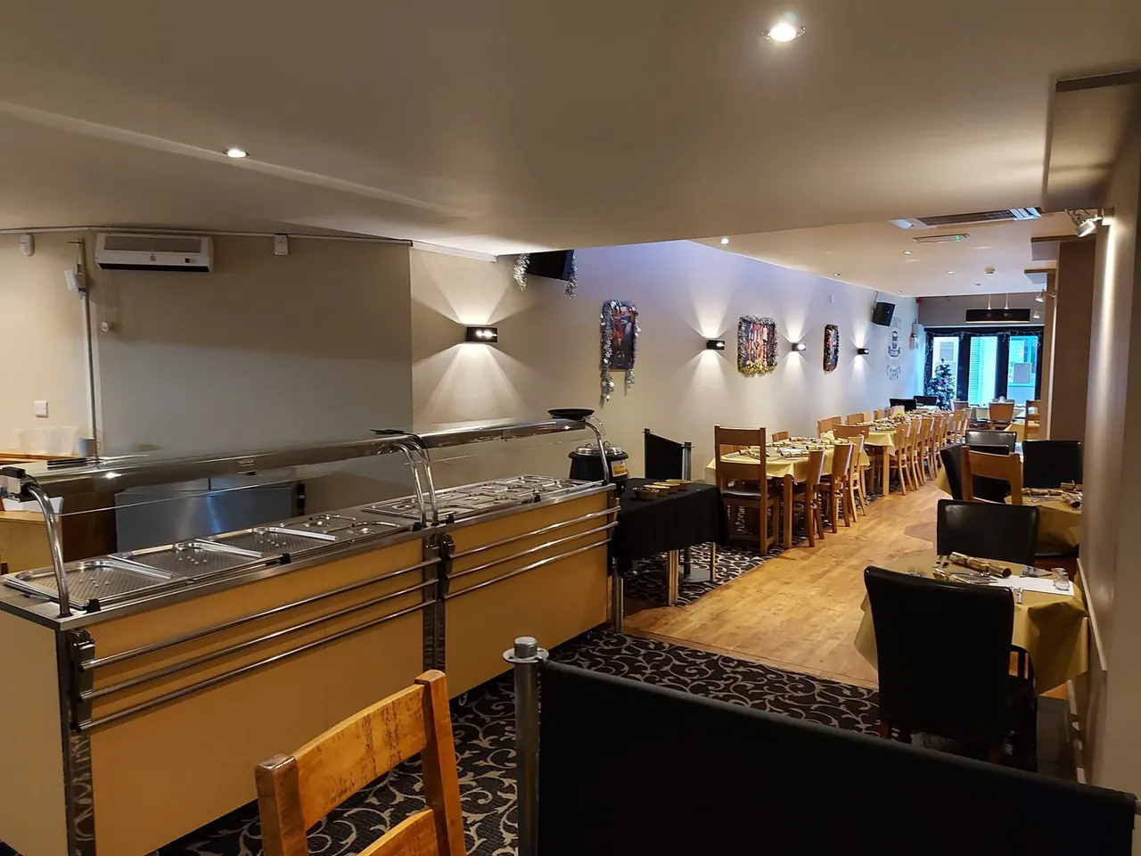 Long view of Enigma's dining room alongside the carvery counter