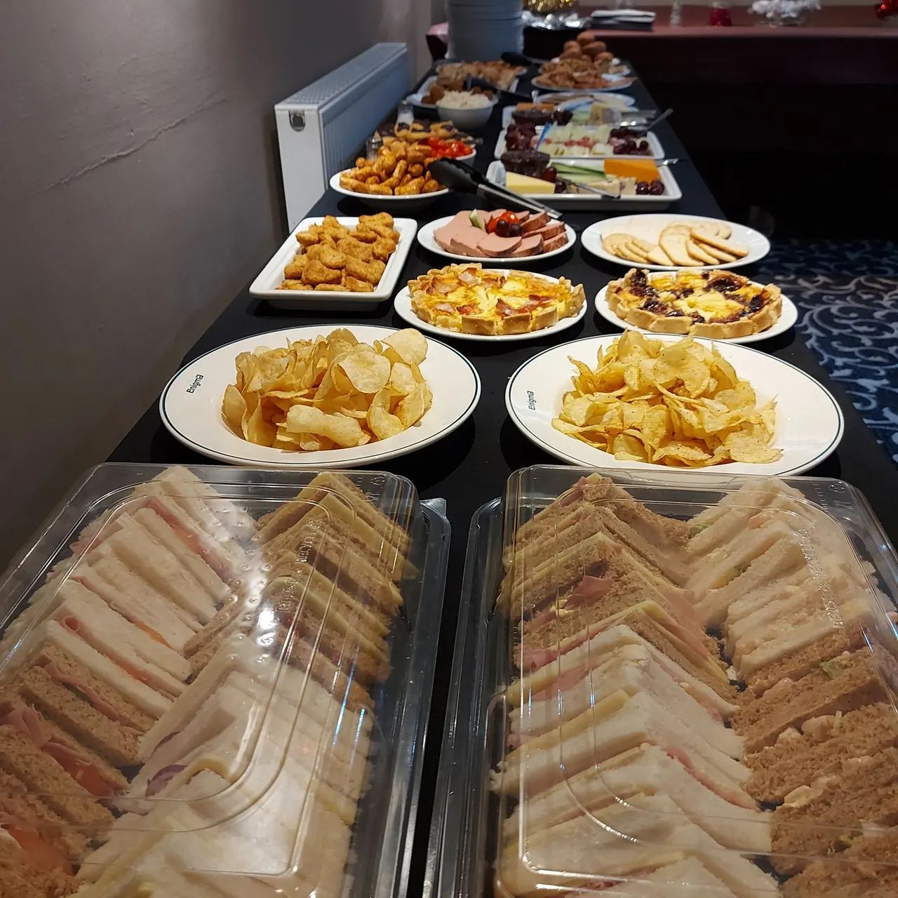 Cold party buffet of sandwiches, crisps and savouries for a private hire